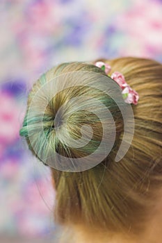 Girl with topknot on nape