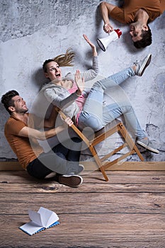 Girl on toppling chair