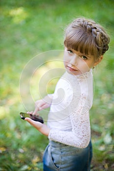 Girl with a touchscreen phone