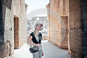 A girl tourist in Ancient Colosseum in Rome, Italy famous travel destinations