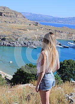 girl tourist dress looks sea top mountain