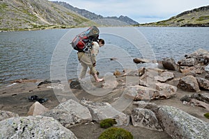 Girl tourist leaves footprints in the sand on the shore of an al