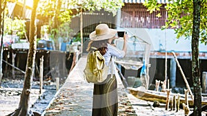 The Girl tourists walking taking pictures The way of life of the villagers in rural villages Ban Bang Phat - Phangnga. summer,