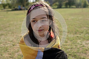 Girl towel in river lying relaxed after swimming bath nature. Girl in a towel