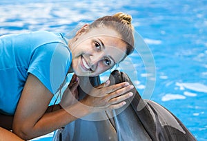 girl, trainer with dolphins
