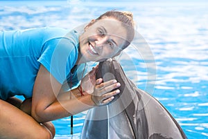 girl, trainer with dolphins