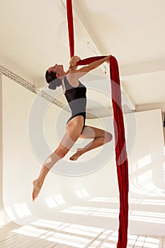 Girl training on aerial silks