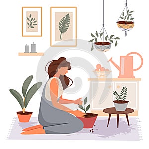 The girl transplants plants at home. Gardening concept.
