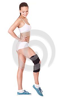 Girl with trauma of knee in brace.
