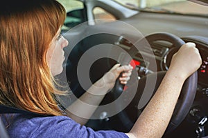 Girl, travel and drive car for transport or road trip, steering wheel and serious in morning for journey to work. Woman