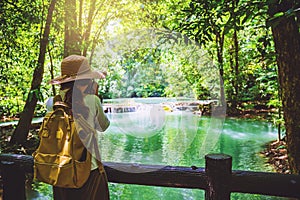 The girl travel take a photo of the Than Bok Thorni Waterfall National Park. lake, mangrove forest. travel nature. Travel relax.