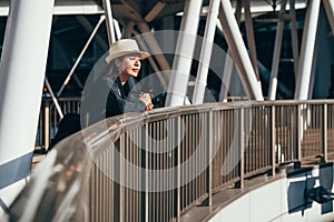 Girl traveler relying on handrail sightseeing