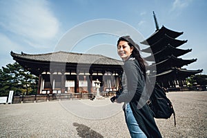Girl traveler sightseeing standing in kofukuji