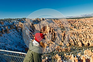Girl traveler on viewpoint in Bryce Canyon National Park in Utah