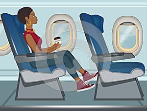 Girl travels by plane in economy class