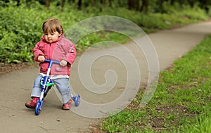 Girl on a tricycle photo