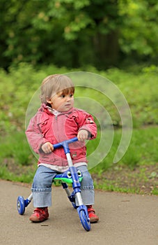 Girl on a tricycle