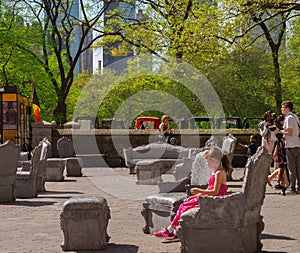 Girl tries out Furniture by Central Park