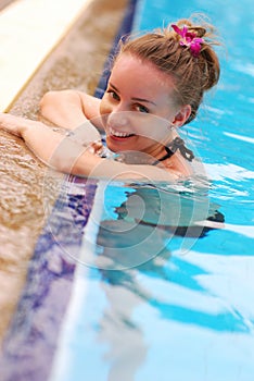 Girl in tropical pool