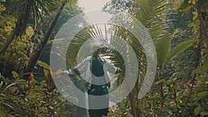 Girl in tropical rain forest jungle