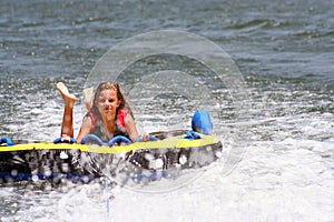 Girl Tubing on the Lake