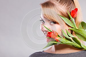 Girl with tulip feel connection to nature.