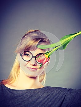 Girl with tulip feel connection to nature.