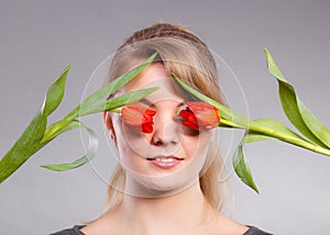 Girl with tulip feel connection to nature.