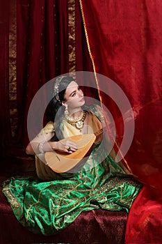 A girl in a Turkish Ottoman historical costume in the style of the magnificent century