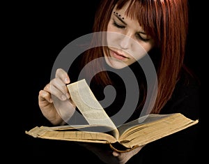 Girl turning book pages