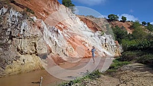 Girl Turns Round in Canyon with Cliff Aerial View