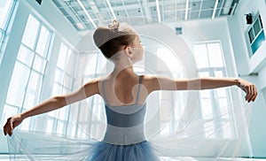 girl in a tutu dancing in the ball room photo