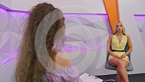 the girl TV presenter is broadcasting live in the studio, communicating with the girl as a guest. prores422