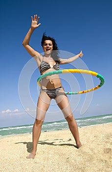Girl Twirling Hula Hoop photo