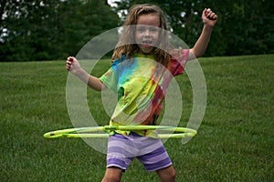 Girl Twirling a Hula Hoop