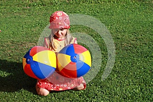 Girl with two colorful balls