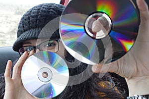Girl with two compact discs