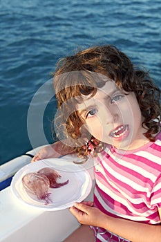 Girl with two jellyfish in boat blue sea photo