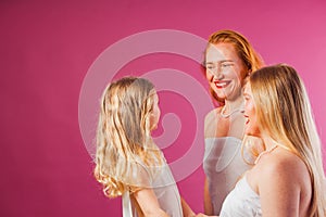 Girl with two women, all wearing white