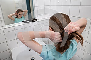 Girl Tying Hair