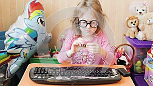 The girl is typing bitcoins on the computer.