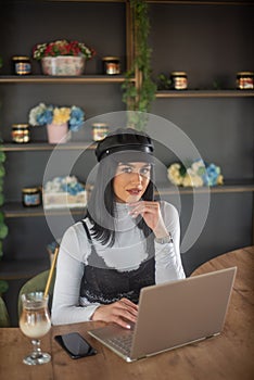 Girl typing on laptop and relaxing