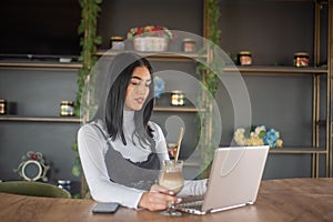 Girl typing on laptop and relaxing