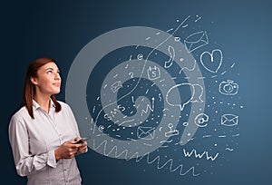 Girl typing on smartphone with various modern technology icons