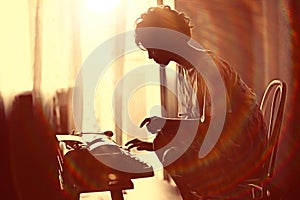 Girl typing on typewriter