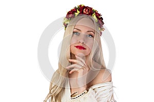 Girl in Ukrainian national costume and flower chaplet