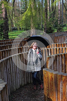 Girl with umbrella in the maze