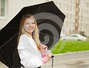 Girl with umbrella outdoors