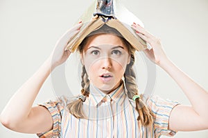 Girl under vintage book