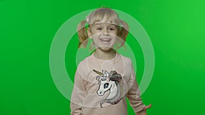 Girl in unicorn sweatshirt. Happy four years old child smiles. Chroma Key